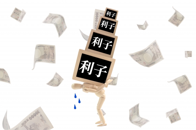 お金を手に頭を抱える。貝塚市で債務整理の無料相談ができます